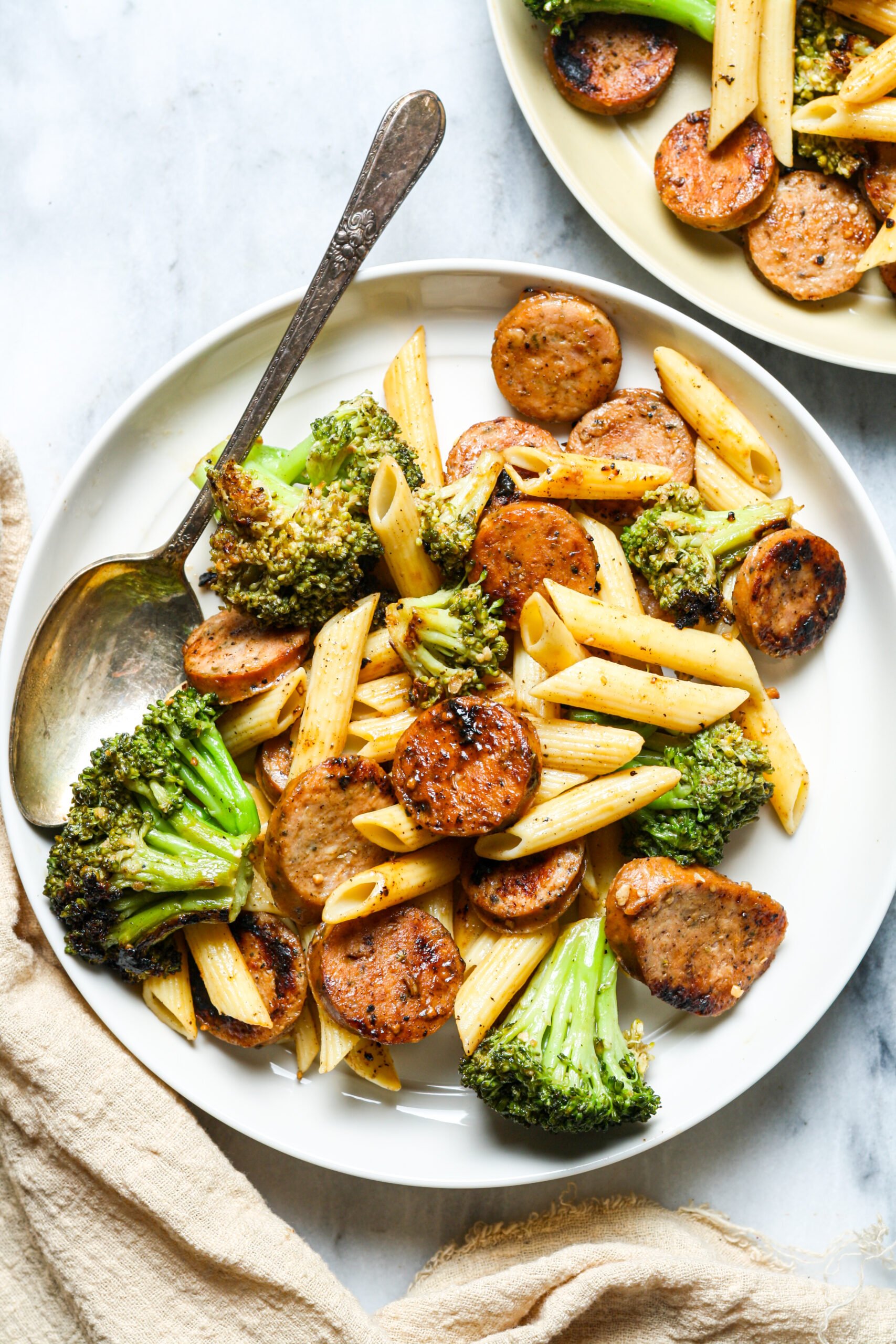 Plate of pasta with sausage.